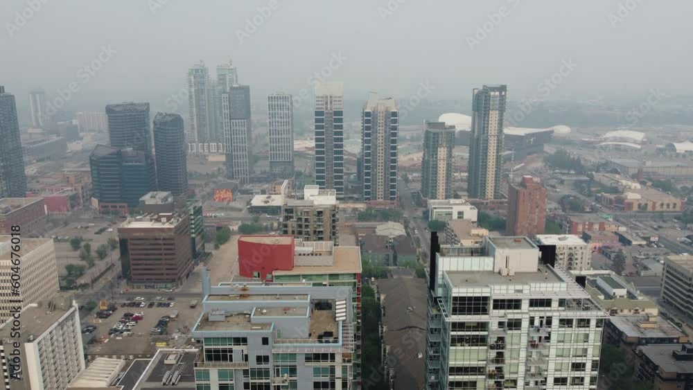 Aerial view of urban Calgary heavy with smoke from massive wildfires in the northern boreal forest. Aerial view of urban Calgary heavy with smoke from massive wildfires in the northern boreal forest.