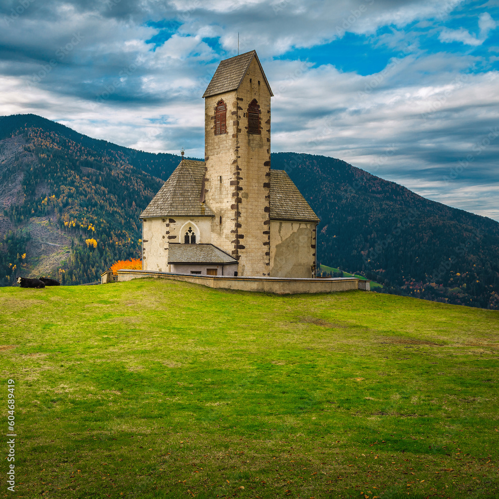 St Jakob church on the green field, Dolomites, Italy