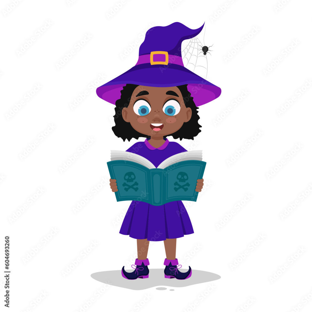 Cute child in witch costume reading a book Cute child in witch costume reading a book