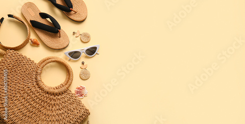 Stylish bag and accessories on beige background with space for text