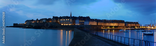 Panoramic night view of walled city Saint-Malo with St Vincent Cathedral, famous port city of Privateers is known as city corsaire, Brittany.