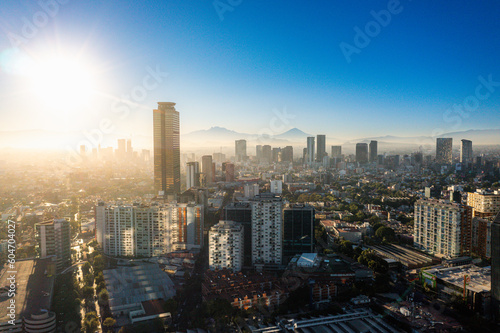 High Altitude Aerial Shot of Popocatépetl and Iztaccíhuatl Volcanoes from Polanco, Mexico City at Dawn