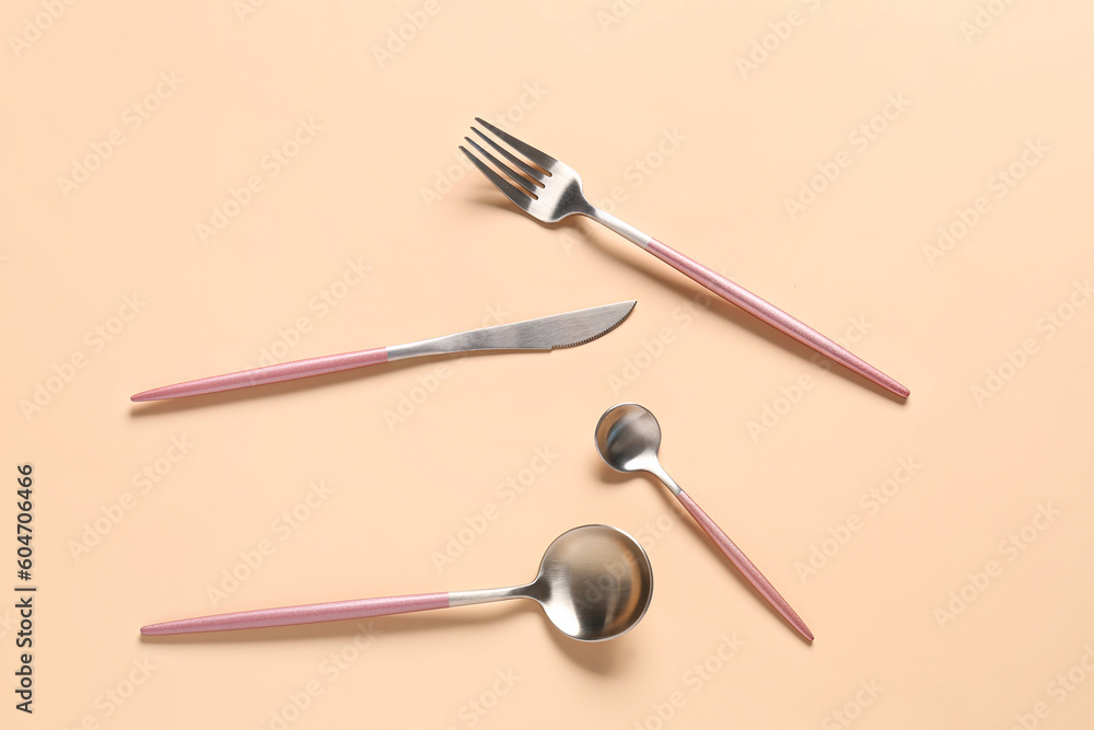 Fototapeta premium Stylish cutlery on beige background