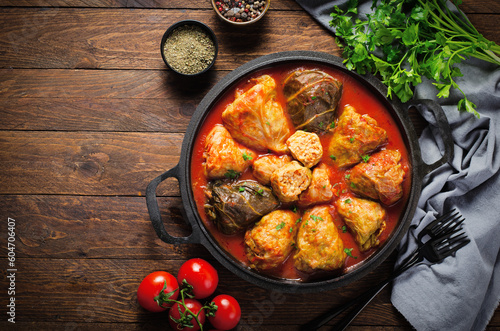 Cabbage Rolls with Ground Meat, Rice and Vegetables also known as Sarma, Golubtsy, Dolma on Rustic Wooden Background