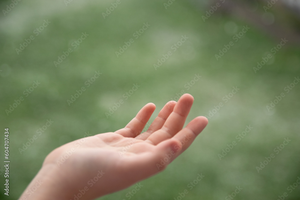 Girls open hand with green natural background. Girls open hand with green natural background.