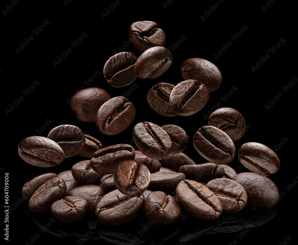 Falling coffee beans isolated on black background Falling coffee beans isolated on black background