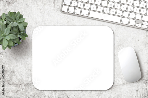 minimalist mousepad mockup with pad, mouse, keyboard and a potted succulent on a white wooden office desk, modern minimal workspace template for your product or design, top view / flat lay photo
