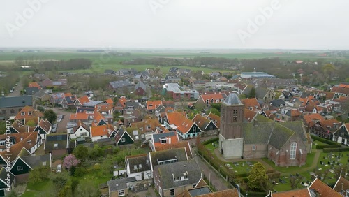 This aerial drone video shows the small village of Oosterend in Texel. Texel is one of the islands in the wadden sea. Oosterend is mostly residential area and there is an old church in the center. photo