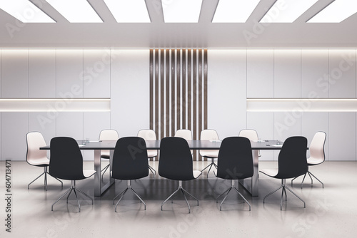 Front view on stylish big dark meeting table surrounded by wheel chairs in spacious modern conference room interior design with light decorated wall background and glossy floor. 3D rendering