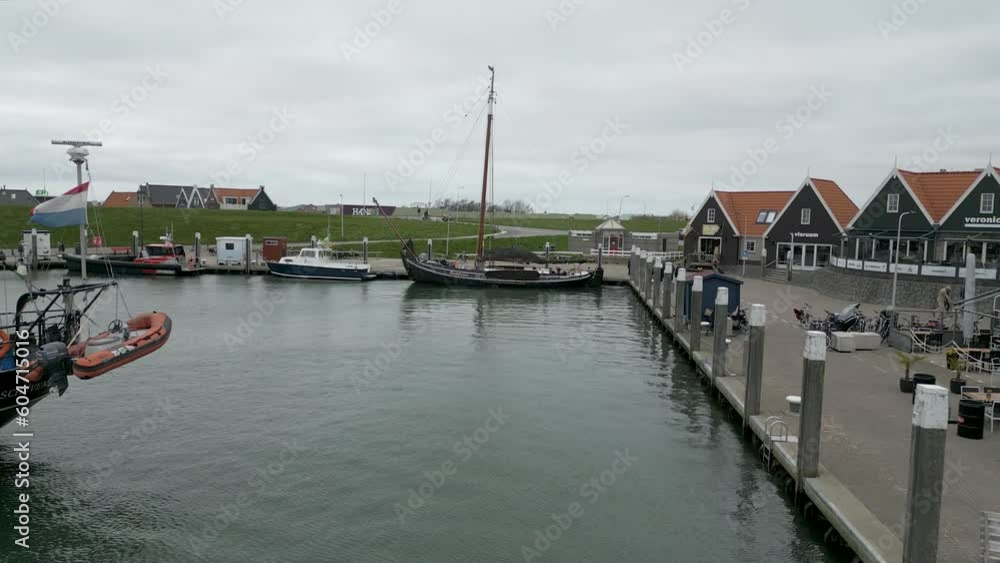 This aerial drone video is made in Oudeschild, a coastal town in Texel. Texel is one of the islands in the Wadden Sea. It has a small harbour with fishing boats and an old small center. This aerial drone video is made in Oudeschild, a coastal town in Texel. Texel is one of the islands in the Wadden Sea. It has a small harbour with fishing boats and an old small center.