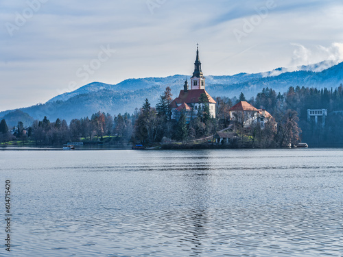 Lake Bled island church and mountains in the background during a winter afternoon in Bled, Slovenia