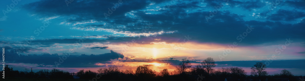 Panorama of a beautiful sunset with clouds