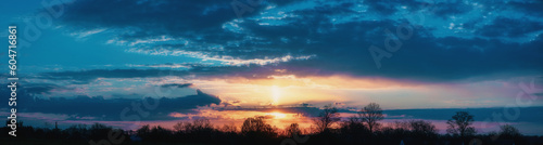 Fototapeta Naklejka Na Ścianę i Meble -  Panorama of a beautiful sunset with clouds
