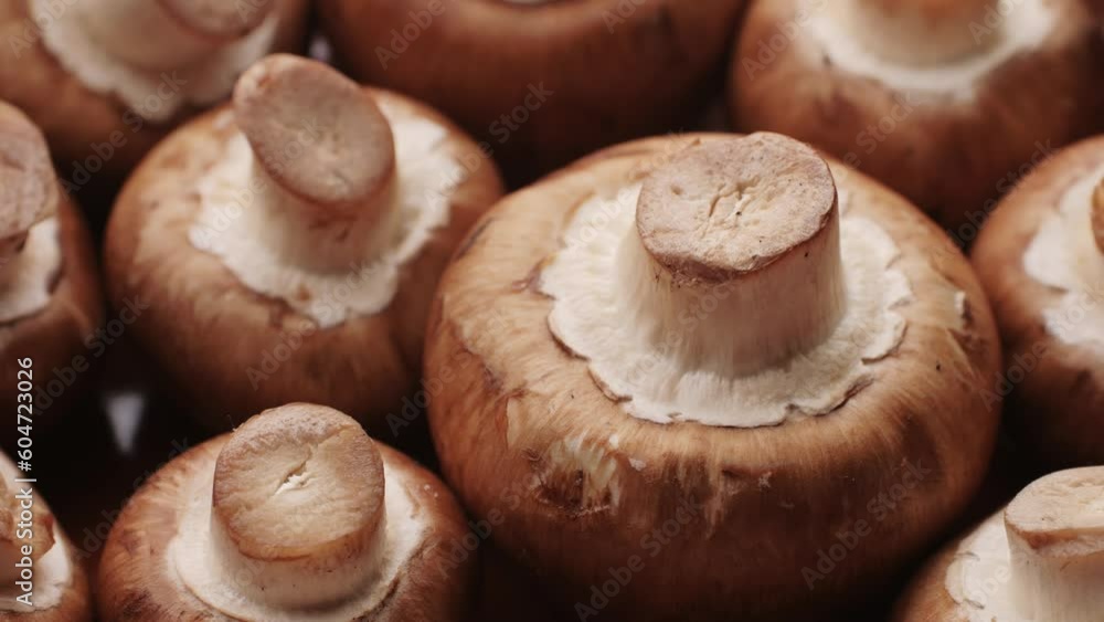 Freshly picked mushrooms on home kitchen, close up texture of brown Champignon, woman cooking tasty vegan dinner. Freshly picked mushrooms on home kitchen, close up texture of brown Champignon, woman cooking tasty vegan dinner.