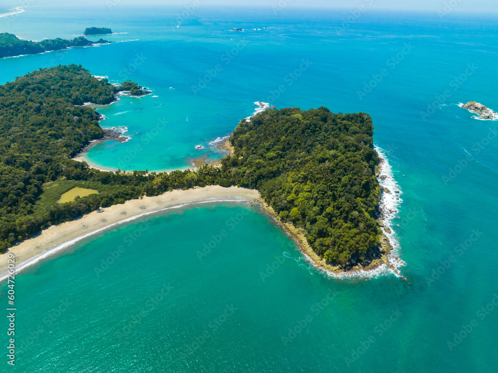 Aerial view of Manuel Antonio National Park in Costa Rica. The best Tourist Attraction and Nature Reserve with lots of Wildlife, Tropical Plants and paradisiacal Beaches on the Pacific Coast.