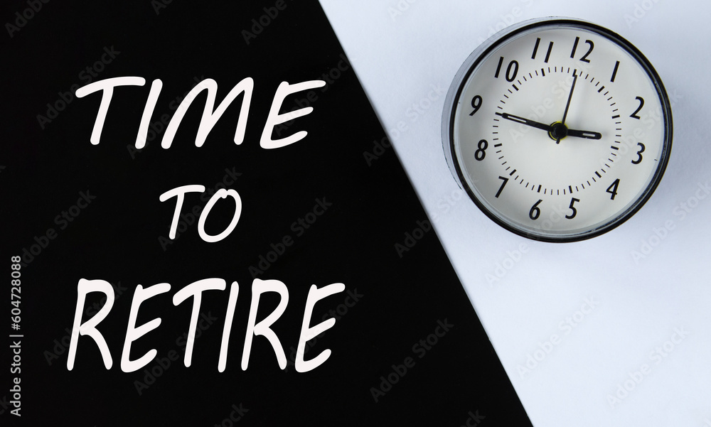 TIME TO RETIRE - words on black background and alarm clock on white TIME TO RETIRE - words on black background and alarm clock on white