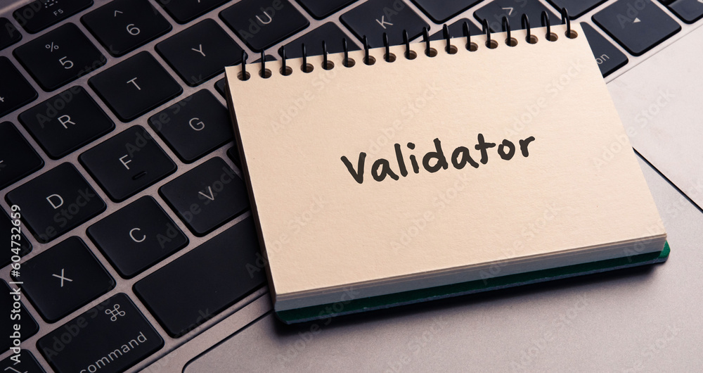 There is notebook with the word Validator.It is as an eye-catching image. There is notebook with the word Validator.It is as an eye-catching image.