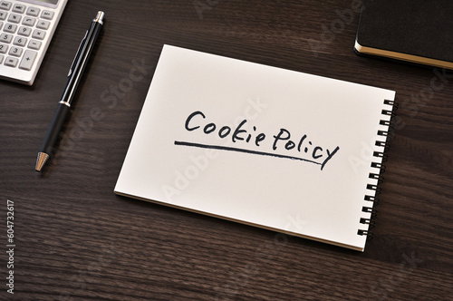 There is notebook with the word Cookie Policy.It is as an eye-catching image.