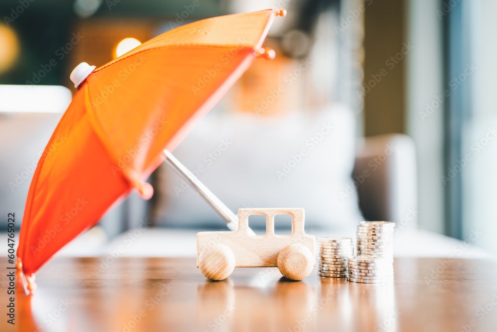 Car symbol and umbrella with coin stack. Concepts of a symbol for ...