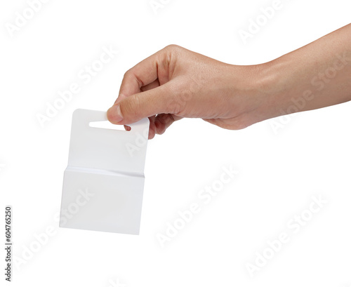 Blank retail packaging white boxes with hang slot holding by a hand. Isolated on white background.
