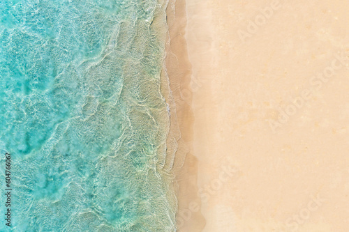 Aerial top down view of beach and turquoise water. Ocean waves on the beach as a background. Beautiful natural summer vacation holidays background. Margaret River, Western Australia. Blue sea water