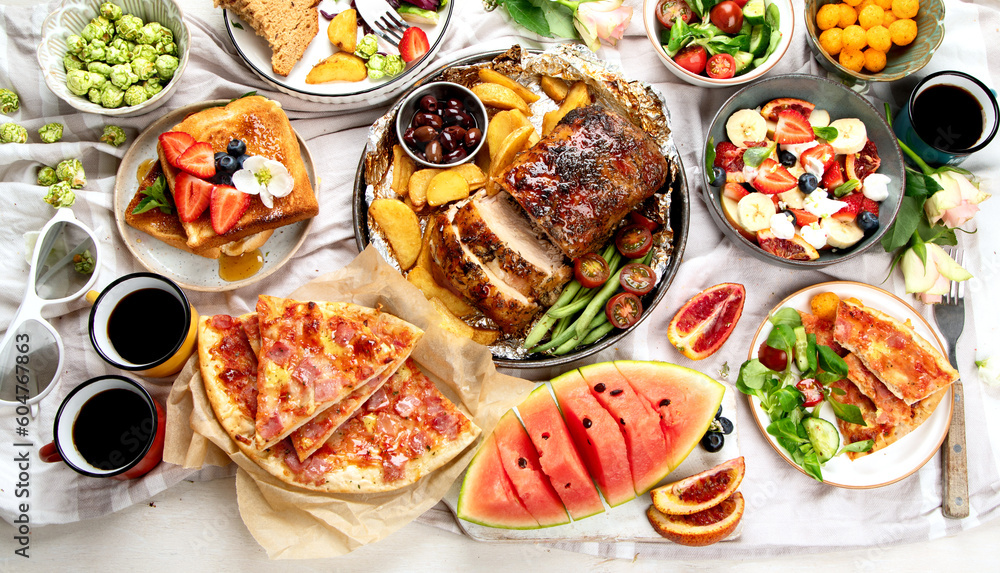 Family dinner or lunch. Many dishes on the table. Top view, copy space Family dinner or lunch. Many dishes on the table. Top view, copy space