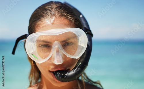 Travel, scuba diving and portrait of woman at the beach for swimming, summer and vacation. Tropical, holiday and gear with female diver and mask at Hawaii seaside for adventure, exotic and explore