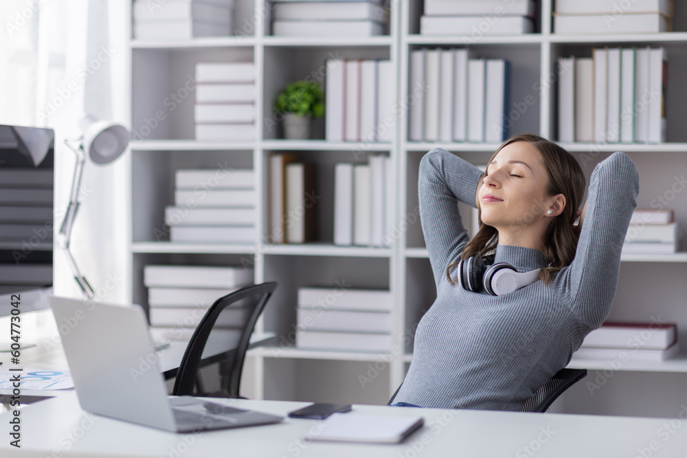 Business woman in office relaxing in chair Business woman in office relaxing in chair