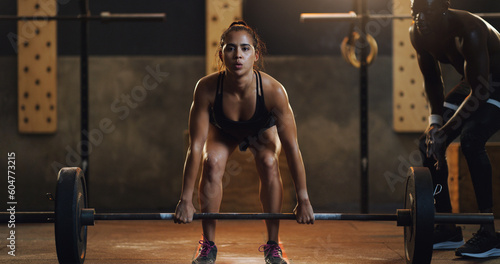 Weight lifting, fitness and portrait of woman with barbell in gym for training, exercise and intense workout. Sports, coach and female body builder lifting weights for challenge, wellness or strength