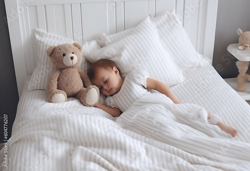 A toddler in white pajamas playing in bed in the morning with teddy bear, generative ai