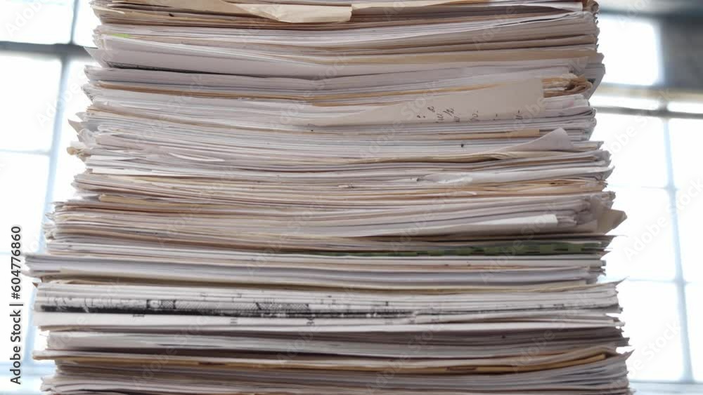 A very large stack of papers. Deadline, office overload, bureaucracy, paperwork A very large stack of papers. Deadline, office overload, bureaucracy, paperwork