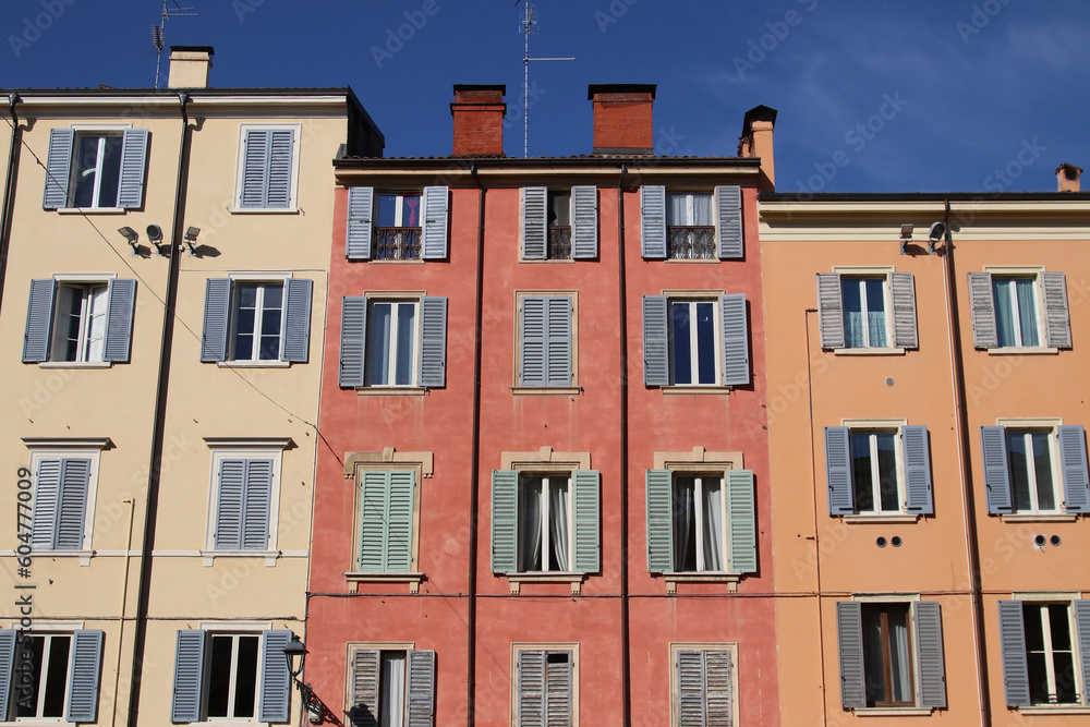 Facades and windows of italian houses in a typical historical city center