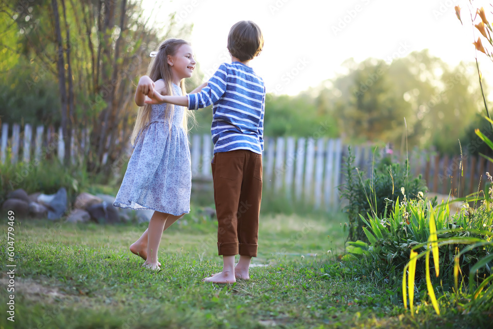 Children walk in the summer in nature. Child on a sunny spring morning in the park. Traveling with children. Children walk in the summer in nature. Child on a sunny spring morning in the park. Traveling with children.
