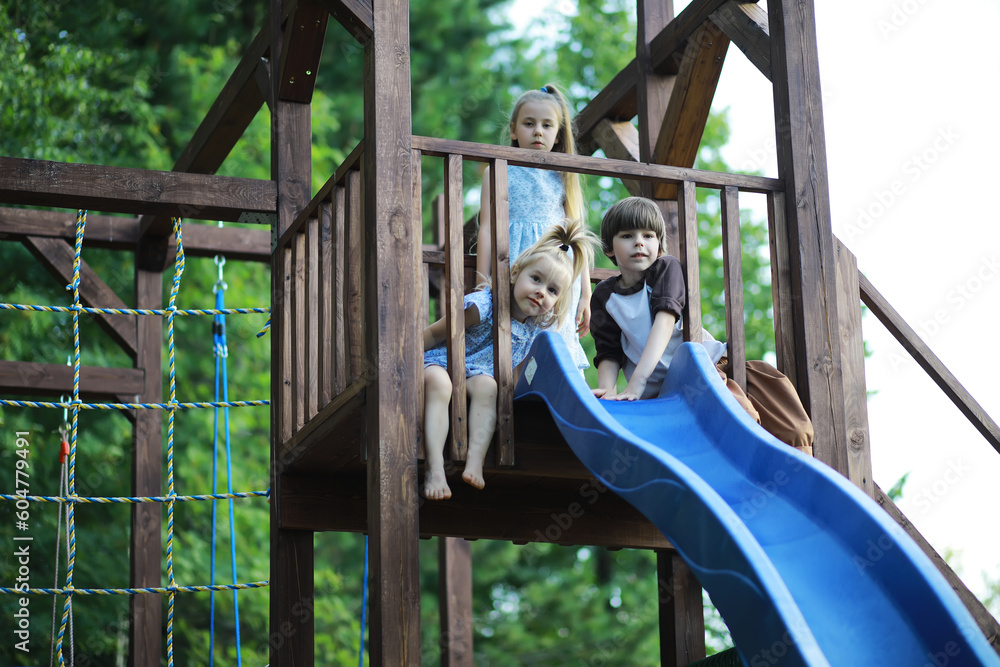 Obraz premium Children walk in the summer in nature. Child on a sunny spring morning in the park. Traveling with children.