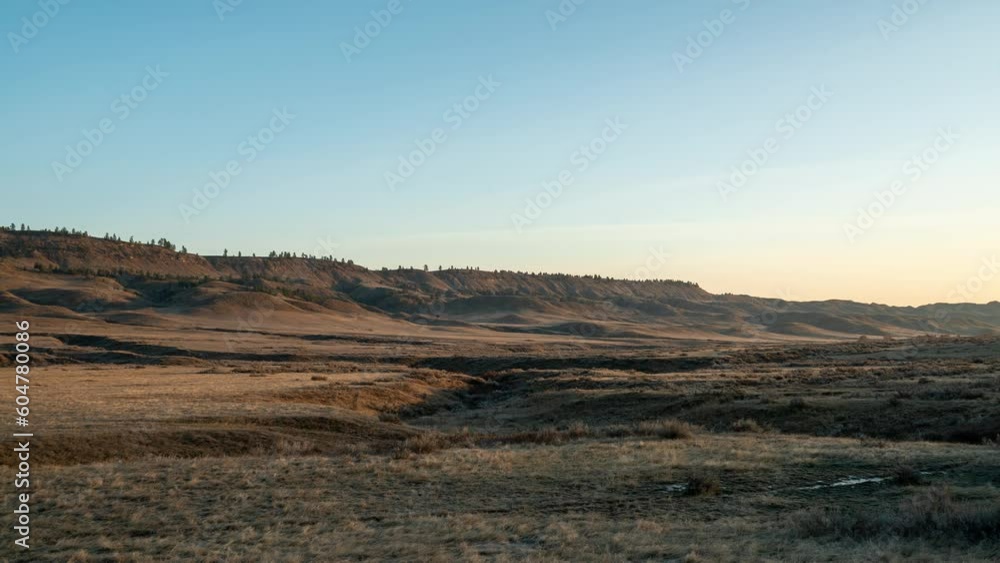 Time lapse sunrise over prairie valley and creek bed Time lapse sunrise over prairie valley and creek bed