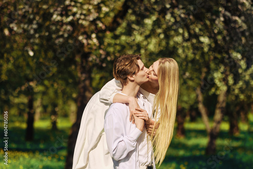 Blonde woman kissing her boyfriend