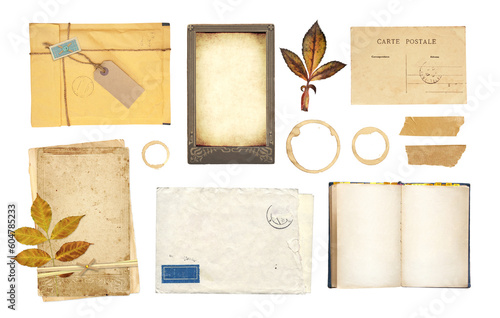 Collection of vintage element for scrapbooking. Set of retro envelope, postcard, open book with empty pages, coffee stain, dry leaf. Isolated on white background. Copy space for text