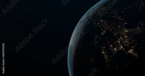 Planet Earth in outer space. Lights of cities on the nightside of planet.