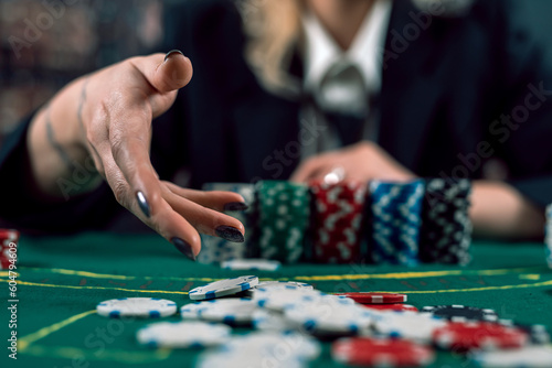 Obraz na plátně dealer or croupier's girlfriend lays out poker cards in local expensive casino