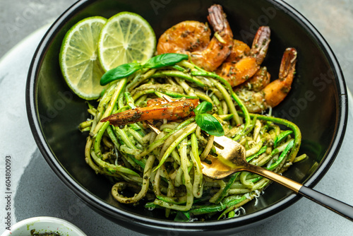 zucchini spaghetti Pasta with basil pesto sauce and grilled shrimp  Vegetarian healthy food  place for text  top view