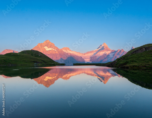 Sunrise view on Bernese range above Bachalpsee lake. Highest peaks Eiger, Jungfrau and Faulhorn in famous location. Switzerland alps, Grindelwald valley