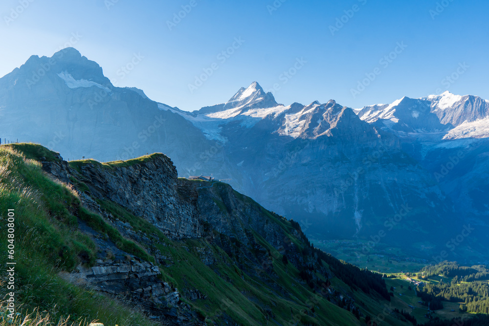 Stunning alpine panorama with Jungfrau,Monch,Eiger North face and Mannlichen cable car station,Grindelwald,Bernese Oberland,Switzerland,Europe