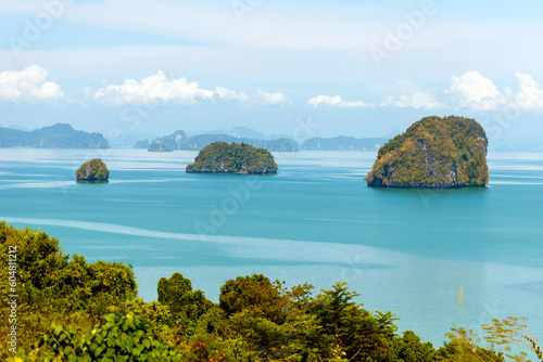 Mountain view in Krabi bay with mangrove forest in Andaman sea with sunny sky, travel destination in Krabi, Thailand.