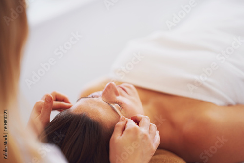 Woman having japan style face massage in salon