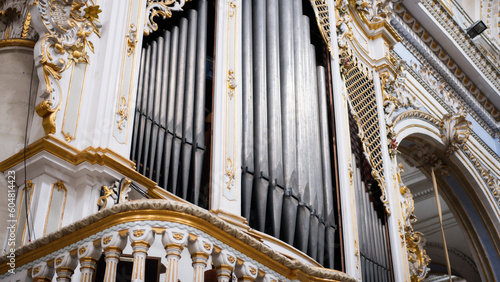 Majestic musical organ into a medieval cathedral with columns