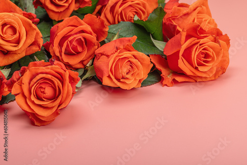 Bouquet of fresh bright roses on pastel pink background. Romantic gift concept  greeting card