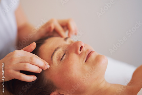 Woman having japan style face massage in salon