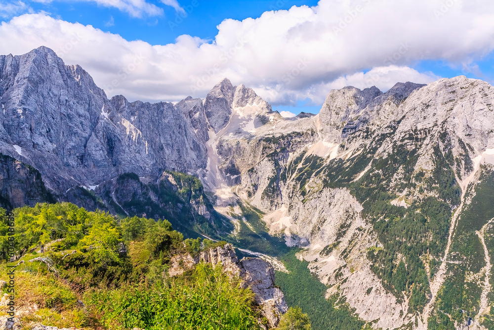 View from Slemenova špica (1911 m) in the Julian Alps (Slovenia) to the rock wall of the surrounding peaks. On the left one of the peaks of Mojstrovka, in the middle - Jalovec (2643 m).