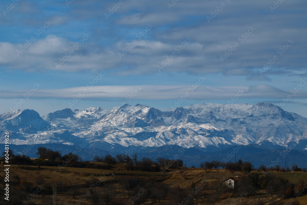 Winter snow covered mountain peaks. Winter snow covered mountain peaks.