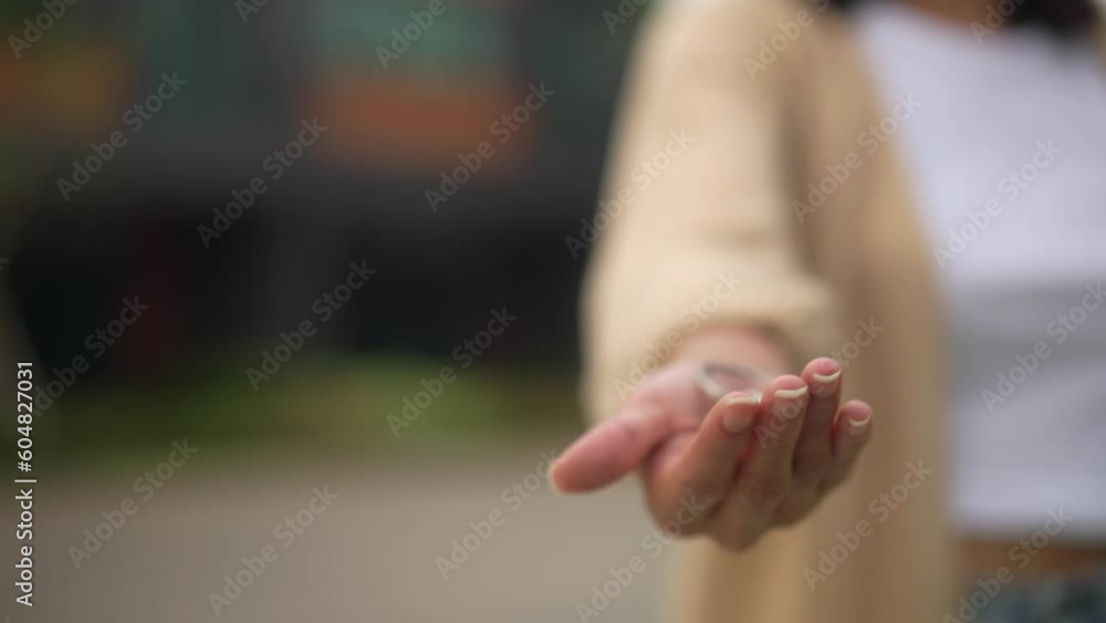 Hands of estate agent giving keys woman buying or rent new home walking to new house. First time to renter or purchase apartment, home. Moving day relocate concept. Hands of estate agent giving keys woman buying or rent new home walking to new house. First time to renter or purchase apartment, home. Moving day relocate concept.